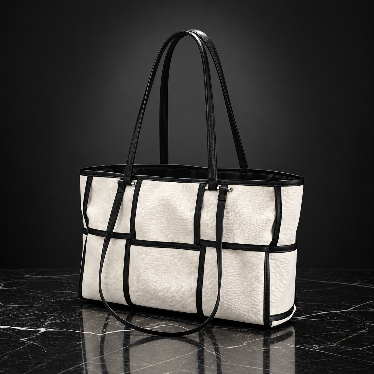Front view of a Black Grid Canvas Tote Bag with a minimalist square pattern and sturdy shoulder straps.