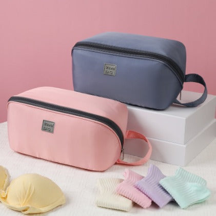 Close-up side view of the Travel Portable Multi-Function Organizer showing its slim profile and durable zipper closure.