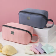 Close-up side view of the Travel Portable Multi-Function Organizer showing its slim profile and durable zipper closure.