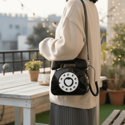 Black bag on-model on the balcony
