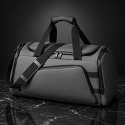 Front angle of a casual lightweight travel duffle bag with top handles and an adjustable shoulder strap for easy carrying.