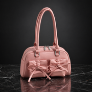 Front view of a stylish Bow-Tie Shoulder Bag showing the large bow detail and structured design.