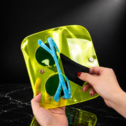Open case with sunglasses in neon yellow